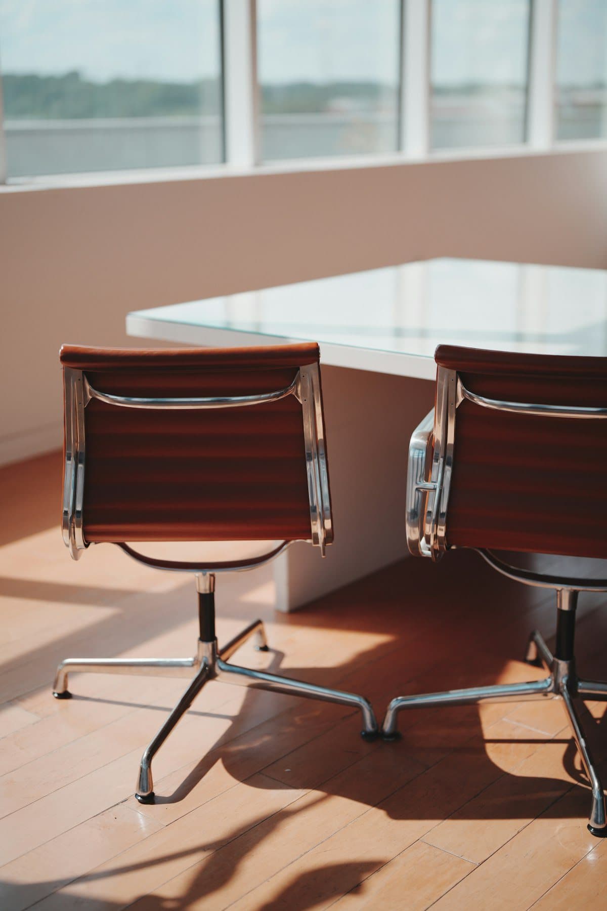 Two chairs beside a boardroom table