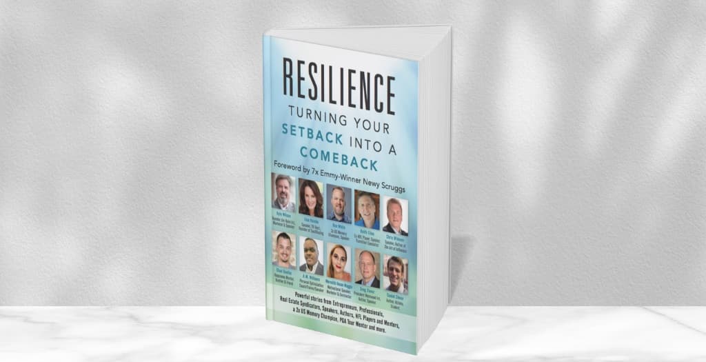 The printed book standing on a marble shelf, with its co-authors pictured on the cover